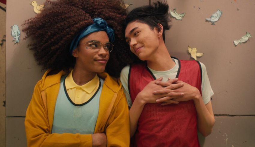 Two young people with afro hair standing next to each other.