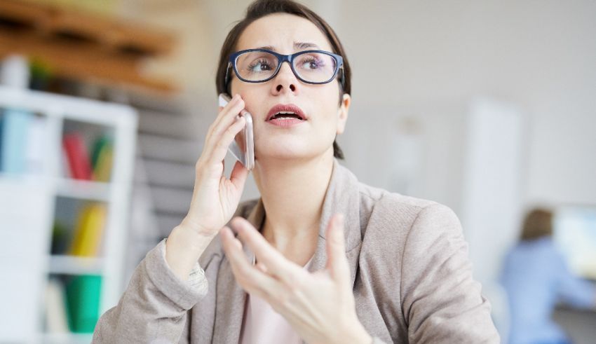 A woman in glasses is talking on her cell phone.