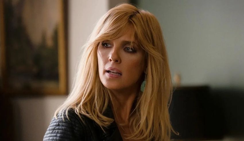 A blonde woman in a black leather jacket.