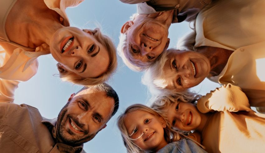 A group of people in a circle looking up at the sky.