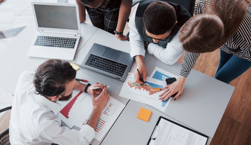 A group of business people working together at a table.