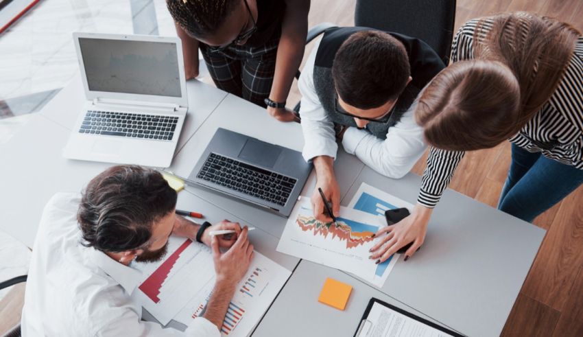 A group of business people working together at a table.