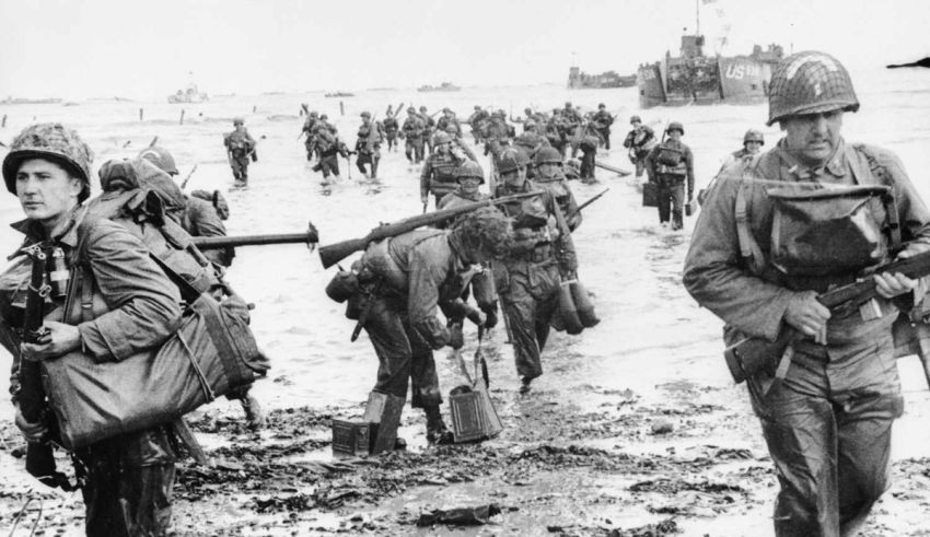 A group of soldiers walking through the water.