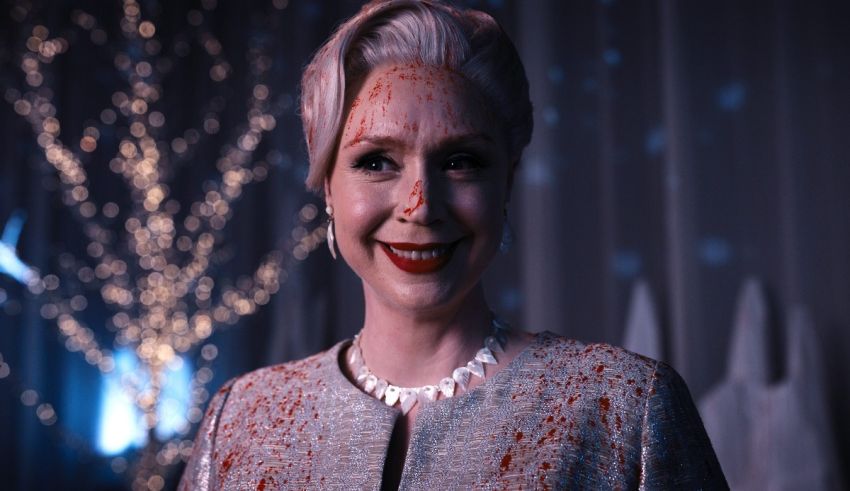 A woman with blood on her face is posing for a picture.