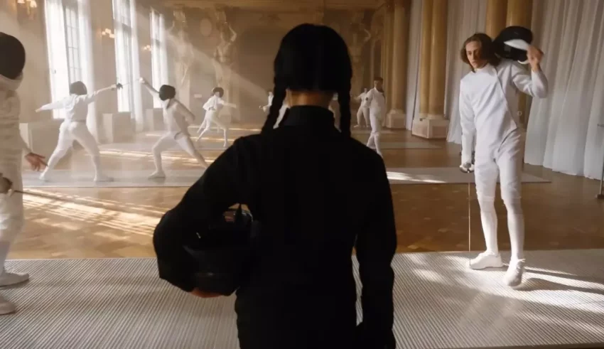 A group of people in white outfits standing in a room.