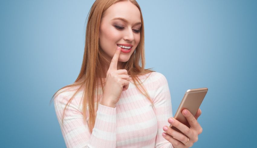 A young woman looking at her smart phone.