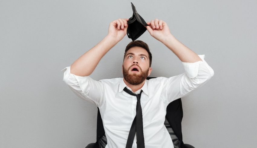 A man sitting in an office chair with his head up.