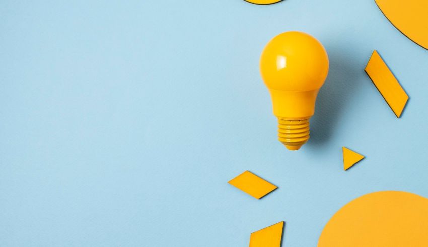 A yellow light bulb on a blue background.
