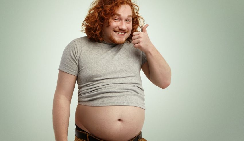 A man with curly hair giving a thumbs up.
