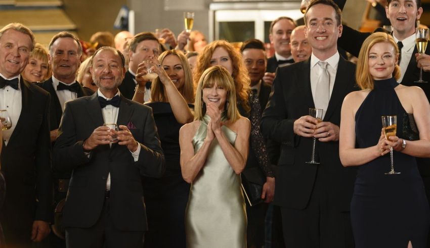 A group of people in tuxedos holding champagne glasses.