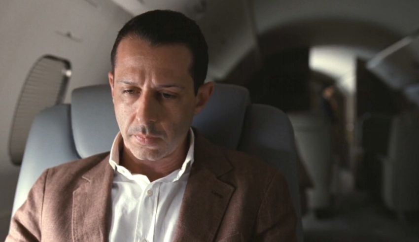A man sitting in the back of an airplane.