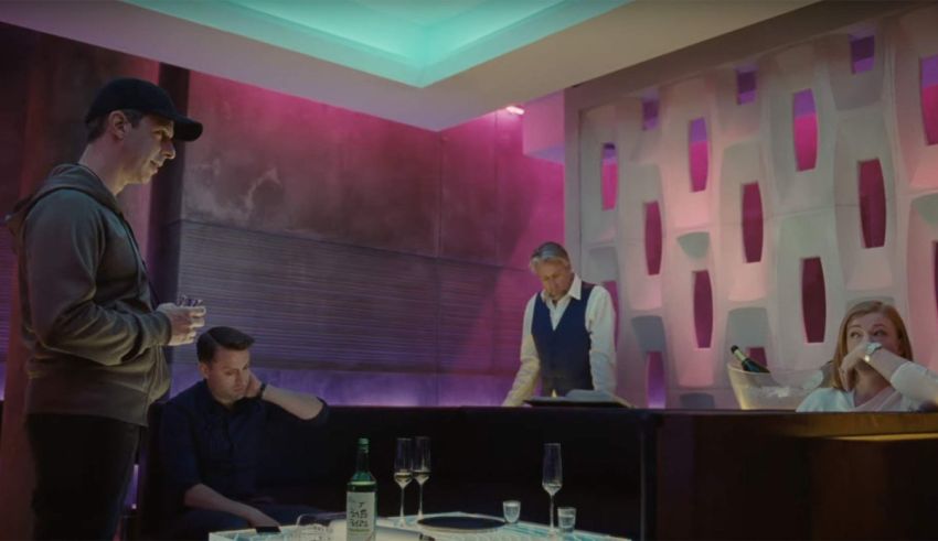 A group of people sitting at a table in a restaurant.
