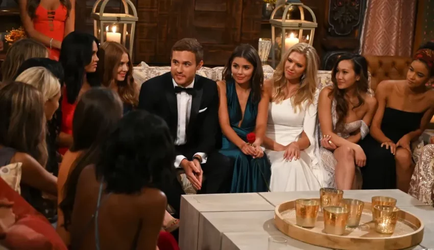A group of people sitting around a table.