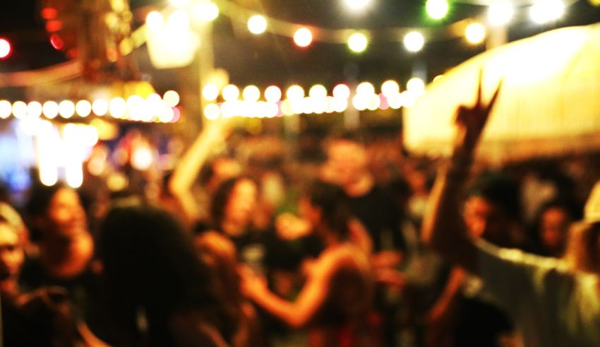 A blurry image of people at a party.