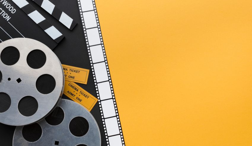 Film claps and film reels on a yellow background.