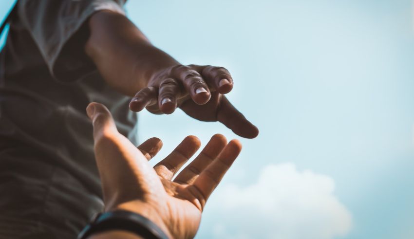 A person reaching out to another person's hand.