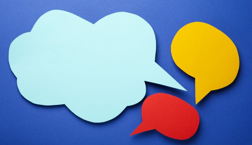 Three paper speech bubbles on a blue background.