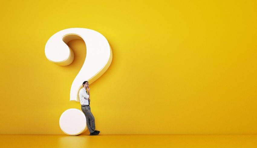 A man standing next to a question mark on a yellow background.