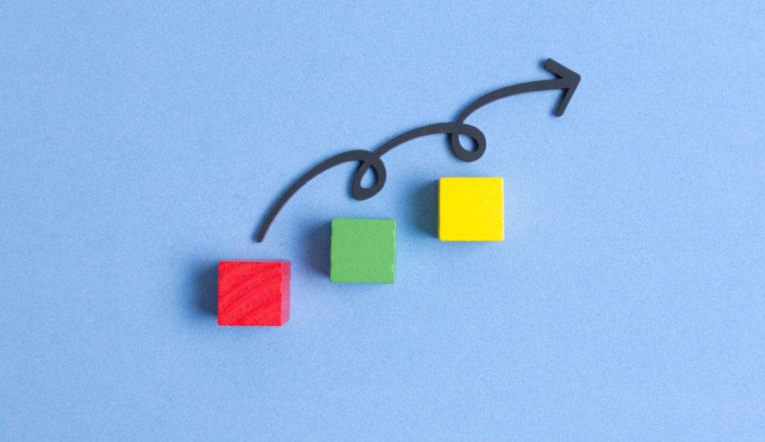 A stack of colorful blocks on a blue background.