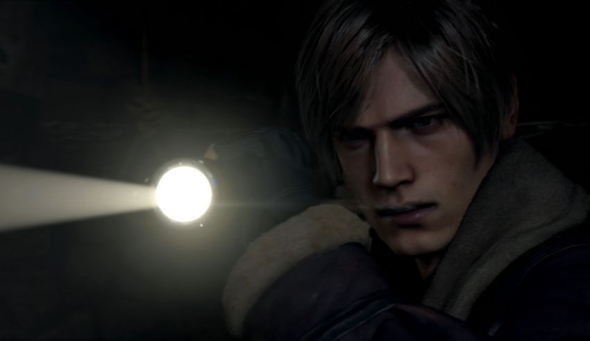 A man holding a flashlight in a dark room.