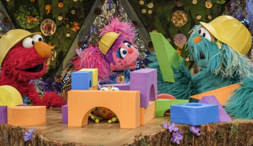 Sesame street's elmo and elmo play with blocks.