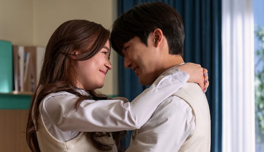 A man and woman hugging each other in a room.