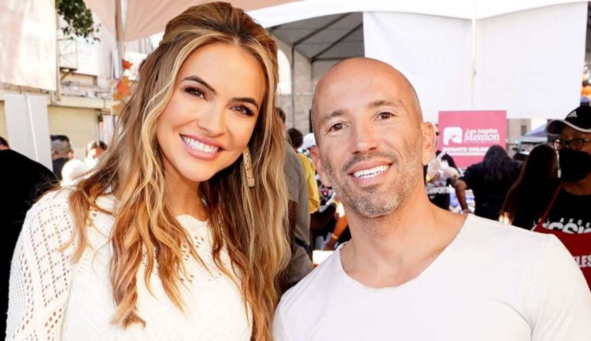 A bald man and a woman standing next to each other.