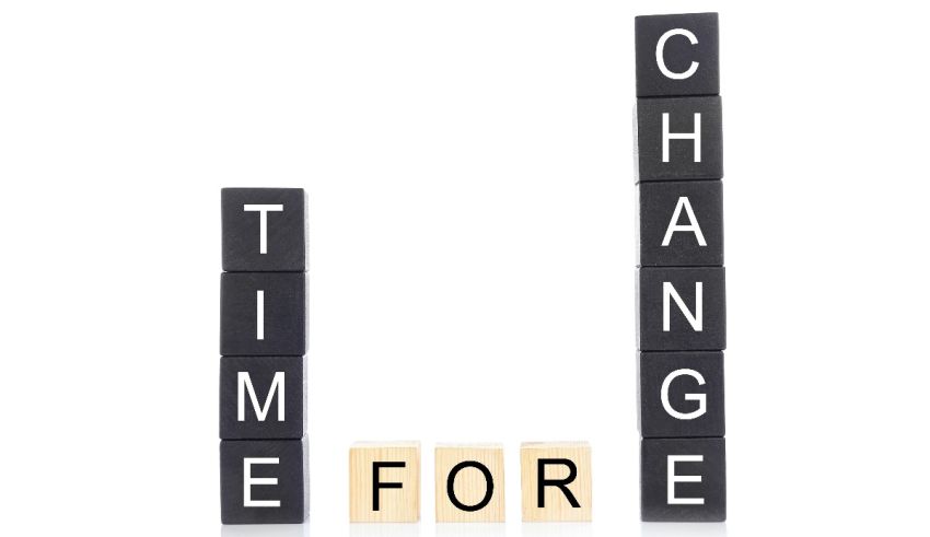 Change time for scrabble blocks isolated on white photo.