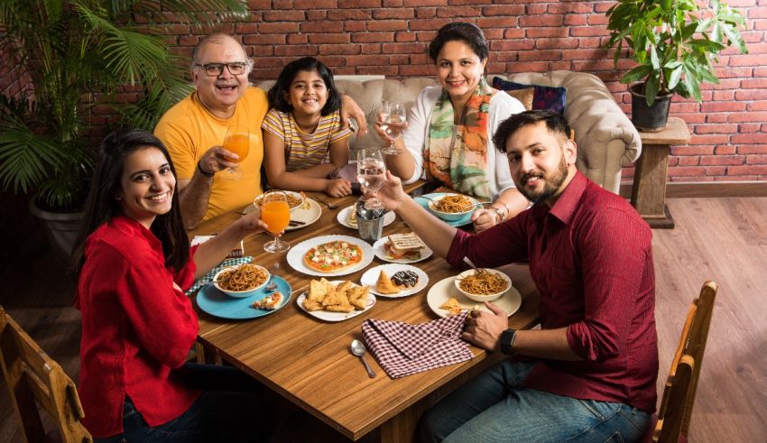 A group of people sitting around a table eating food.