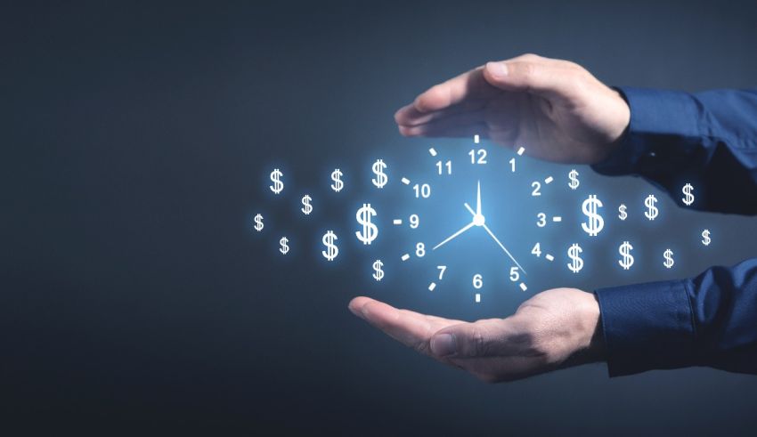 A man's hands holding a clock with dollar signs coming out of it.