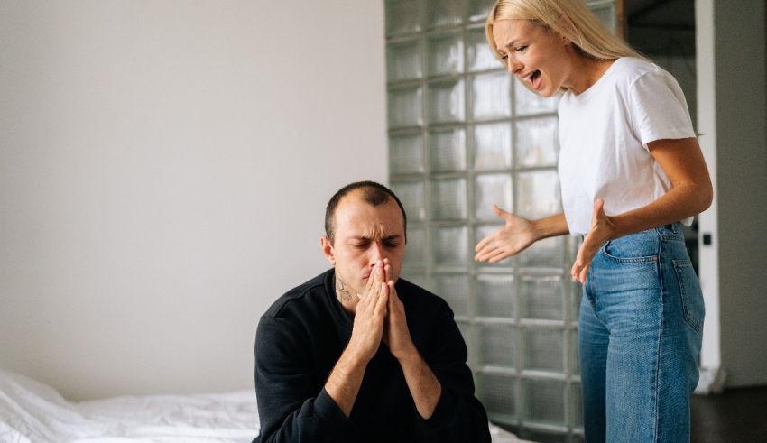 A man and woman are arguing on the bed.