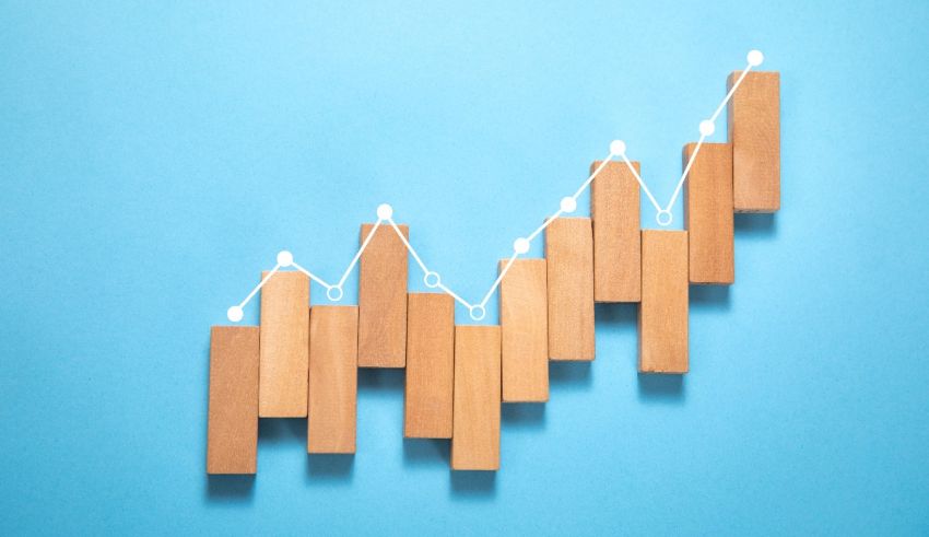A wooden bar graph on a blue background.