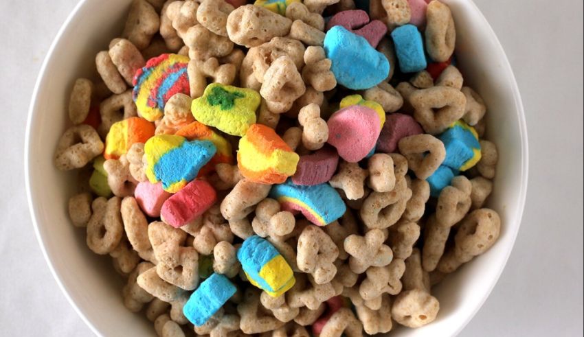 St patrick's day cereal with rainbow sprinkles in a bowl.