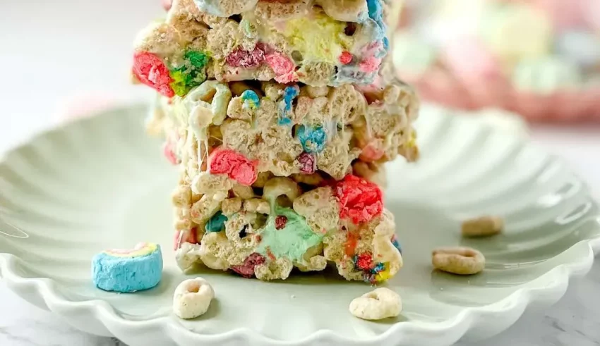 A stack of cereal krispy treats on a plate.