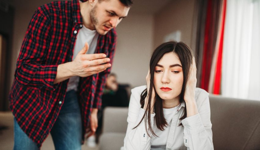 A man and woman arguing in the living room.