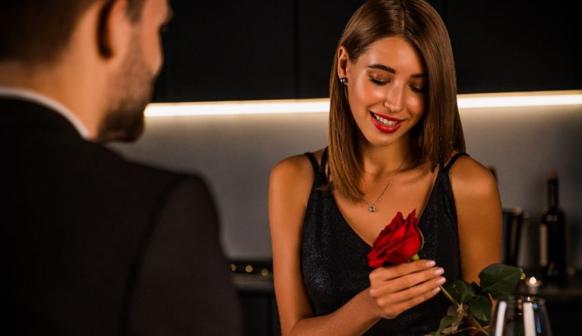 A man is giving a woman a rose.