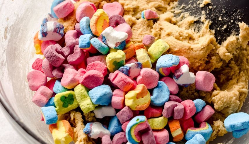 Shamrock cookie dough in a bowl with candy hearts.