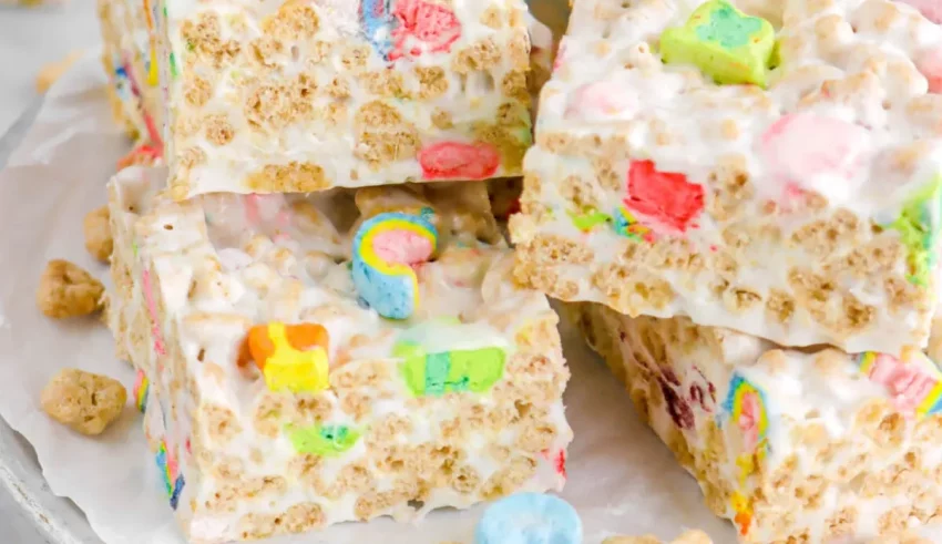 A stack of rainbow cereal bars on a plate.