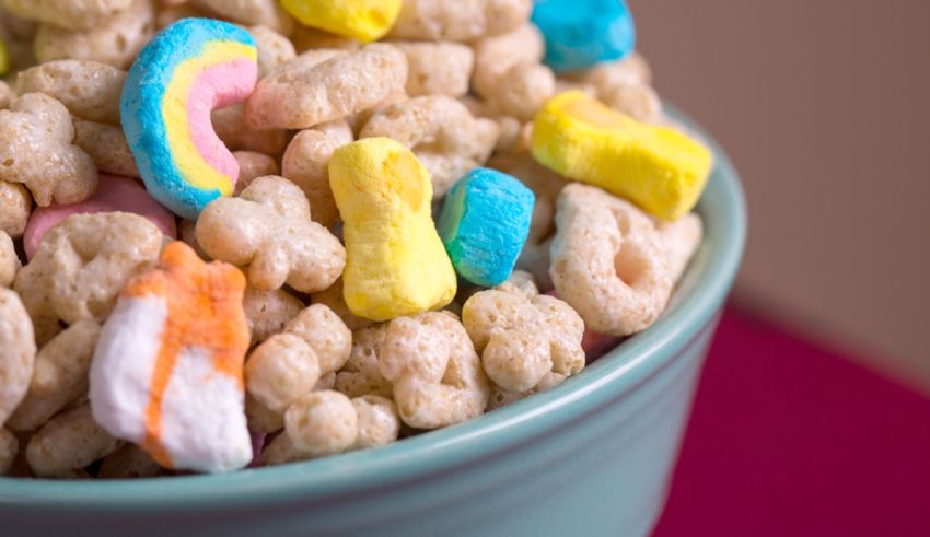 A bowl of cereal with colorful candies in it.