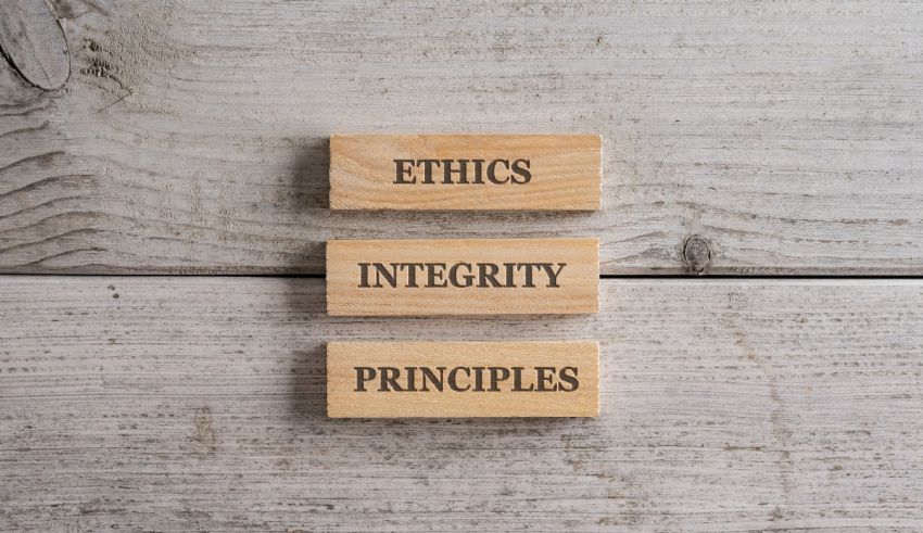Three wooden blocks with the words ethics, integrity and principles.