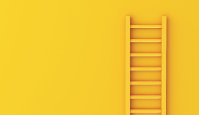 A yellow ladder on a yellow background.