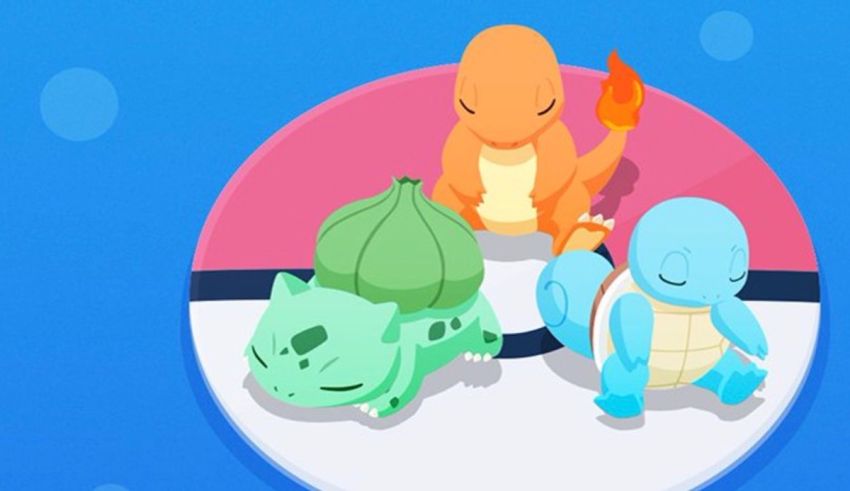 A group of pokemon sitting on top of a ball.