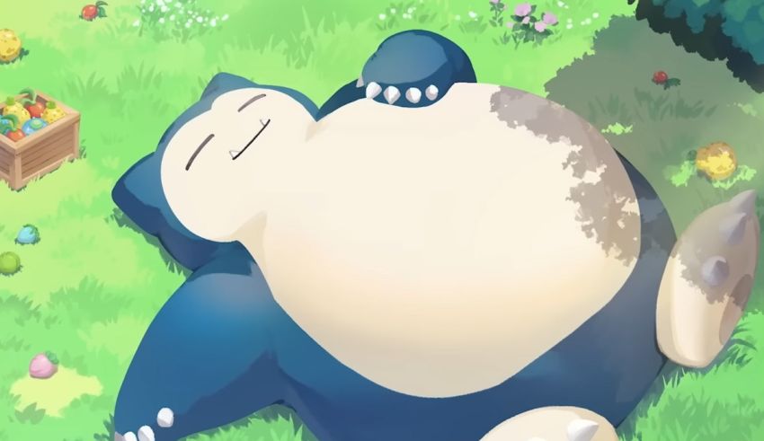 A large pokemon laying down in the grass.