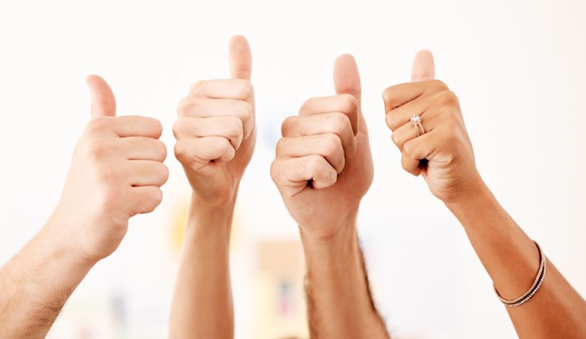 A group of people giving thumbs up.