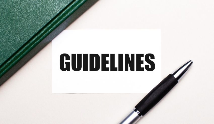 Guidelines on a piece of paper next to a pen.