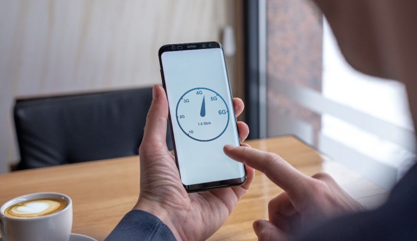 A man holding a smartphone with a clock on it.
