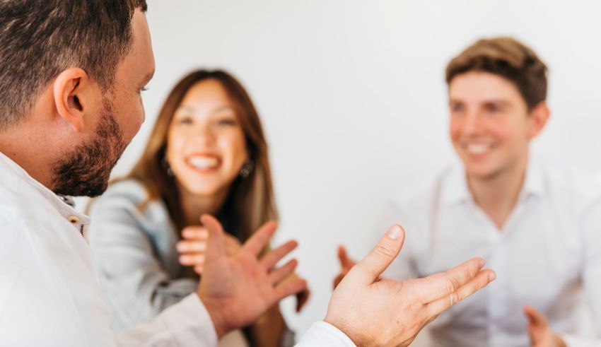 A group of people talking in a meeting.