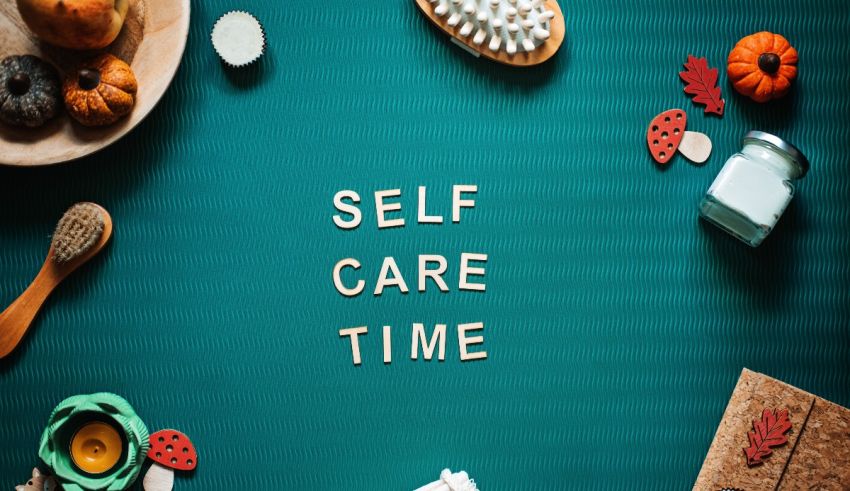 Self care time spelled out on a green table.
