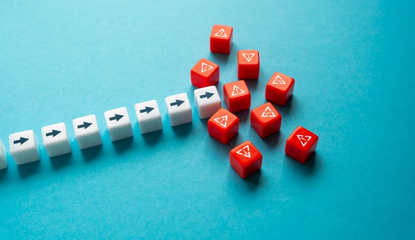 A group of red dice with arrows on a blue background.