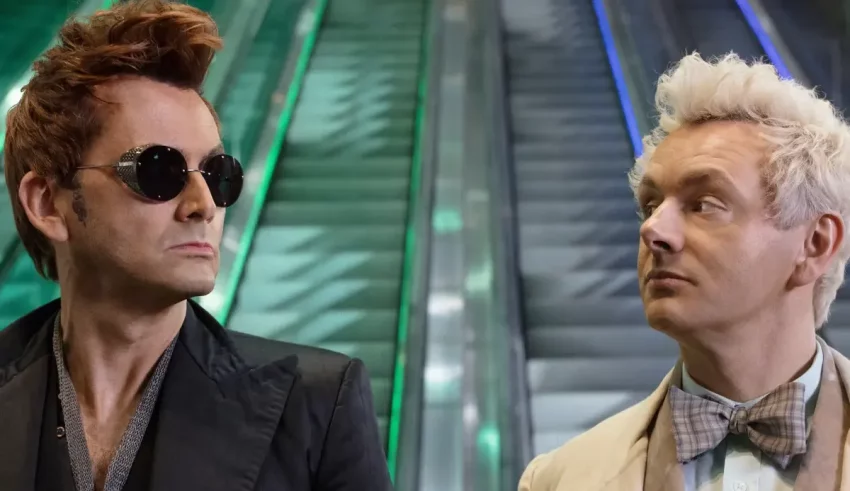 Two men standing next to each other on an escalator.